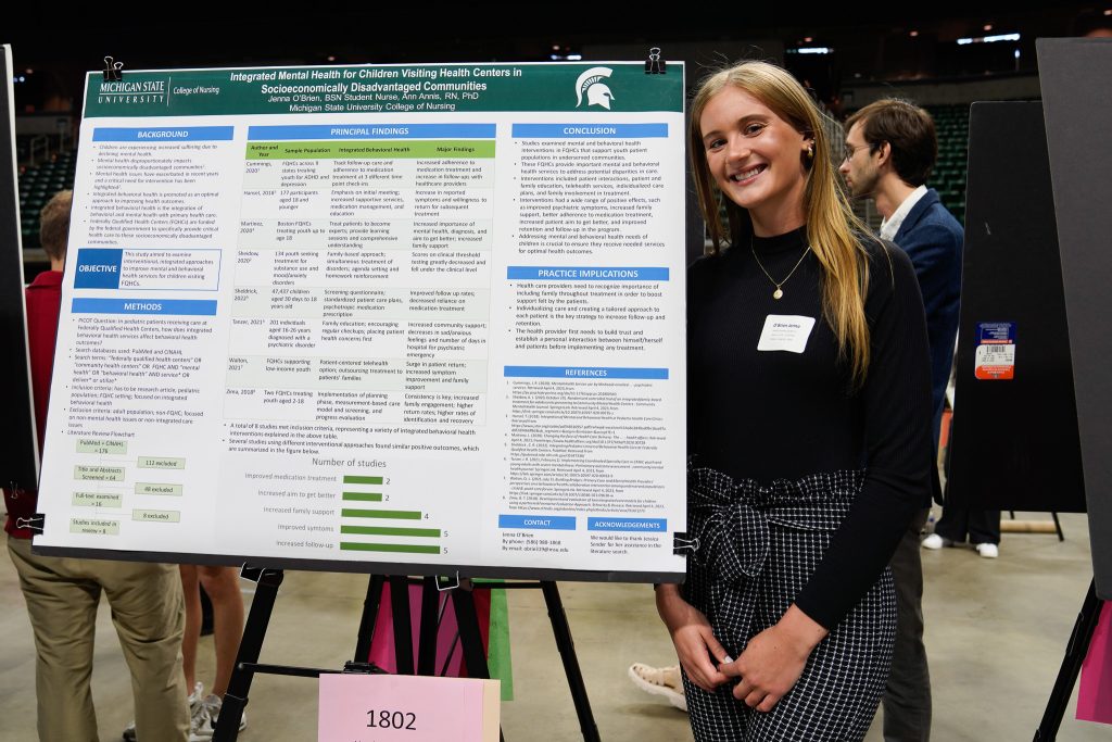 Nursing third-year Jenna O’Brien in front of her UURAF poster on April 14, 2023.