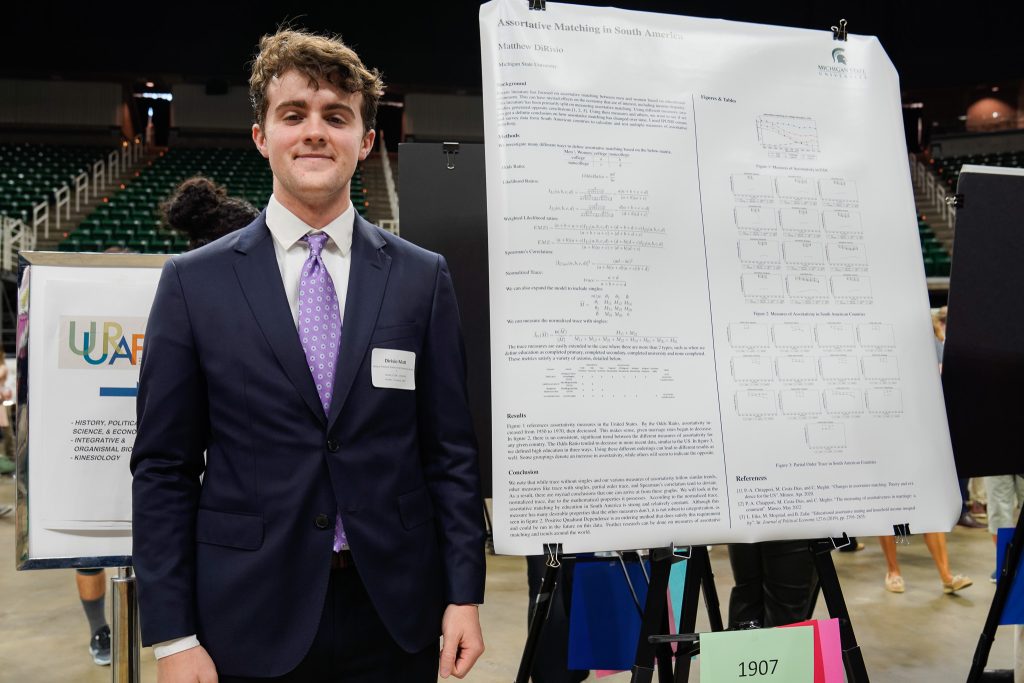 Computer science and economics fourth-year Matthew DiRisio in front of his UURAF poster on April 14, 2023.