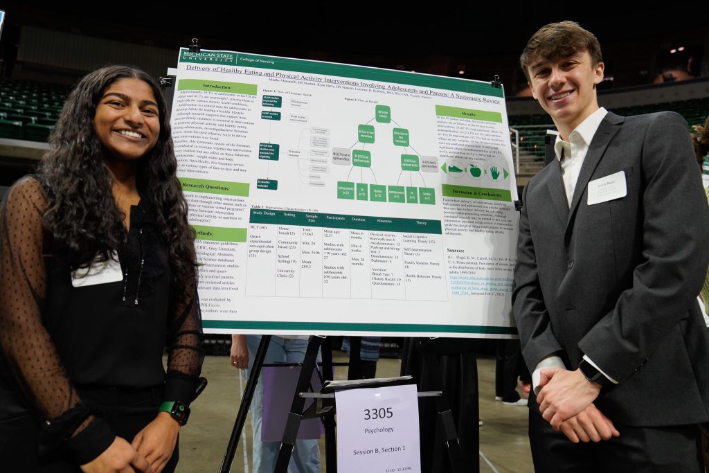 Human biology second-year Medha Manepalli and human biology second-year Ryan Hertz in front of their UURAF poster on April 14, 2023.