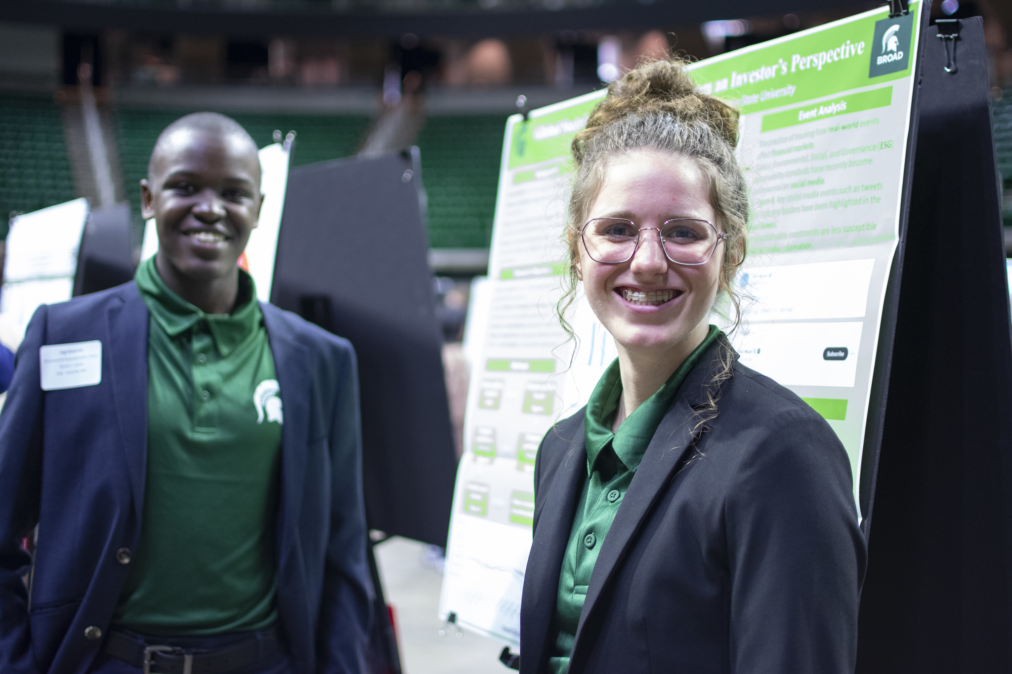 Jogi Katende and Delani Stull pose with their poster presentation at UURAF