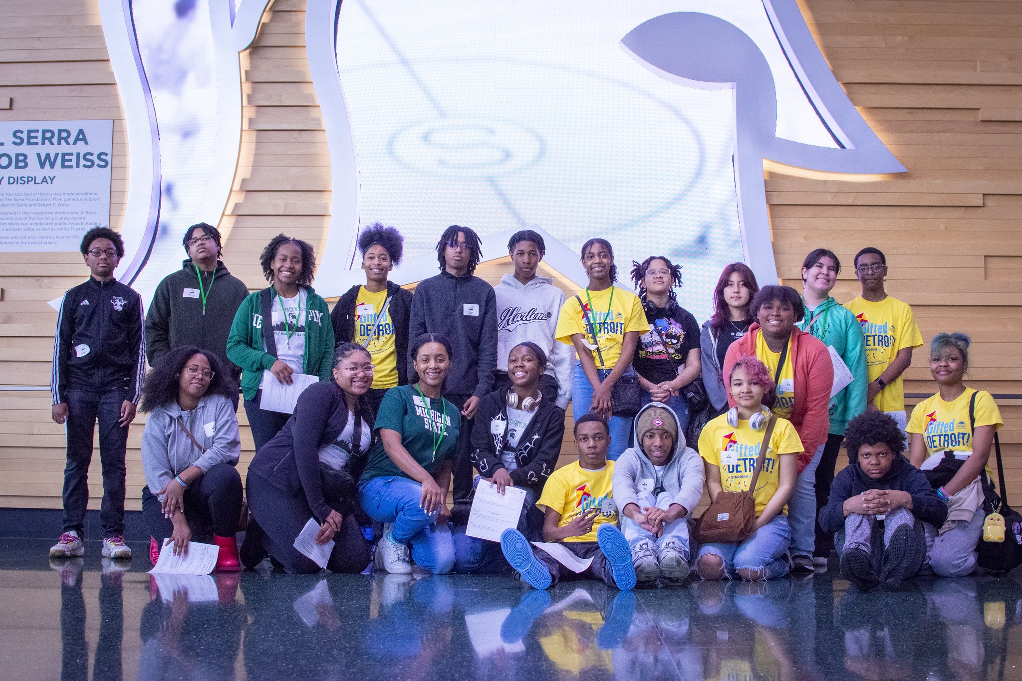 Students from the Detroit Early Honors Experience pose in the Breslin Center as they visit UURAF