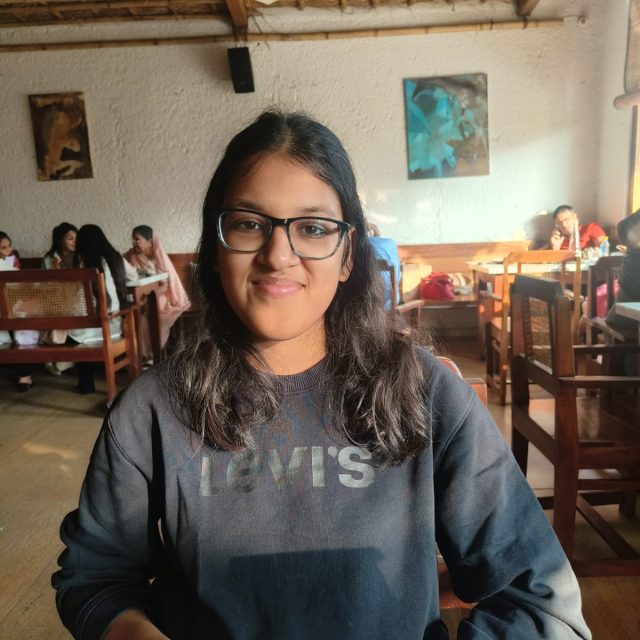 Nandini Jaithalia profile photo wearing a navy blue Levi