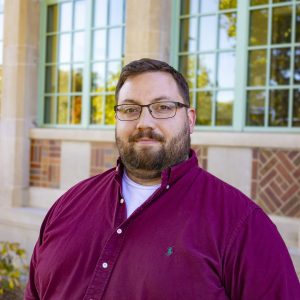 Chris Graham headshot in front of Campbell Hall.