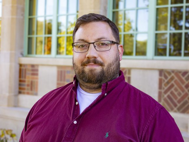 Chris Graham headshot in front of Campbell Hall.