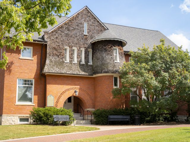 Image of the exterior of Eustace Cole Hall on a sunny day.