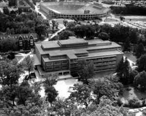 Image in black and white from above of MSU Libraries, with Spartan Stadium in the background.