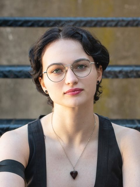 Image of incoming MSU Honors College student and Williams Scholar Marissa Schnurstein in a black top. A black railing is in the background.